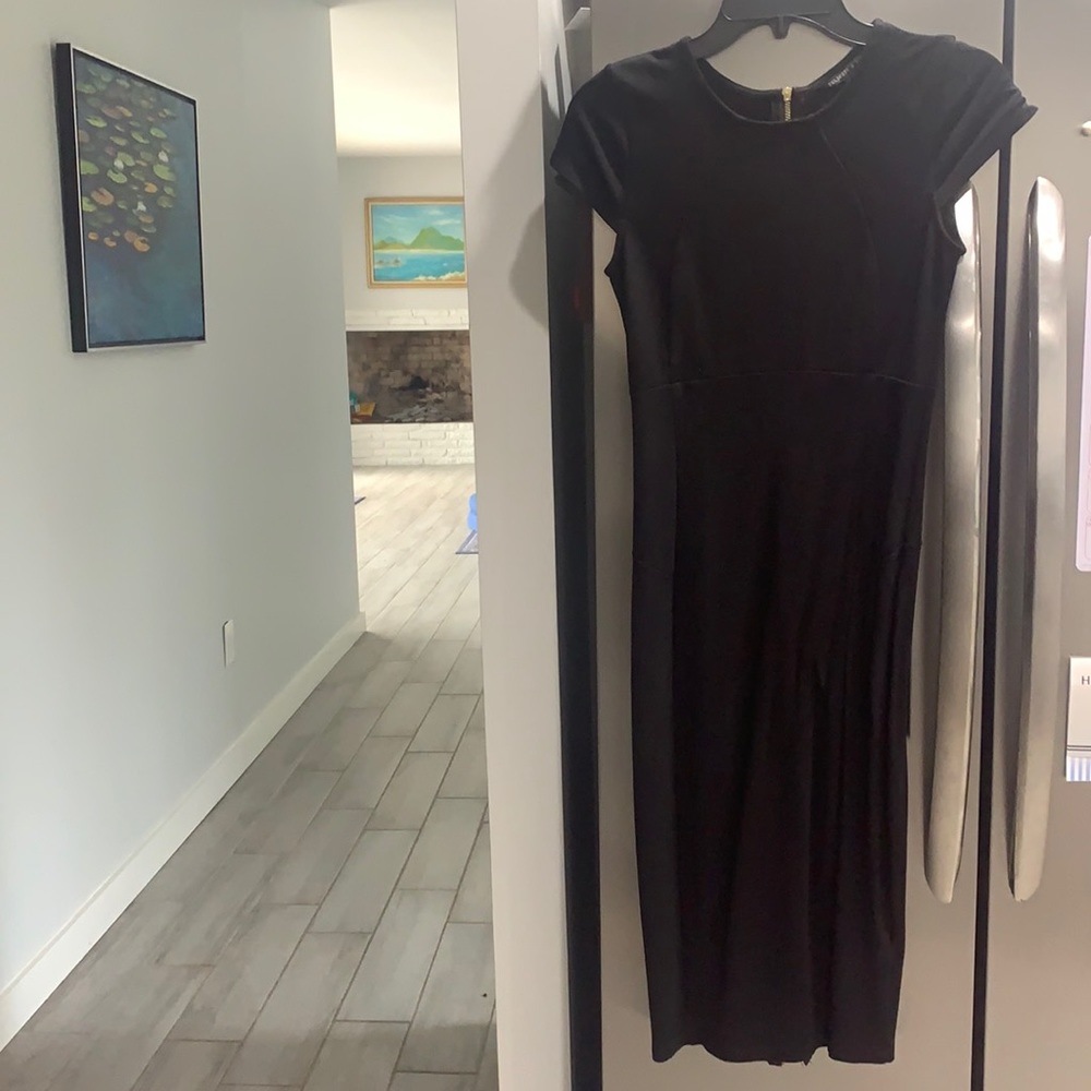 Small Black Bodycon midi dress. Zips from top and from bottom. Great condition.